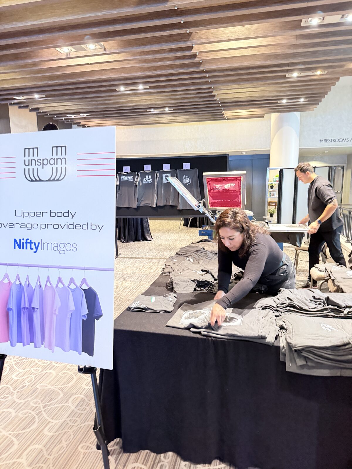 Merch Troop live screen-printing station running at a Miami event